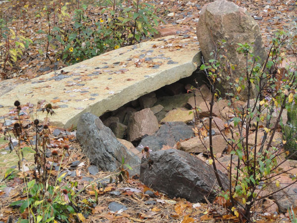 Large flat rock used as stepping stone bridge
