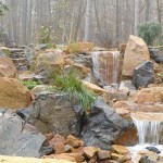 Large waterfalls contracted of a mix of gray and red large rock