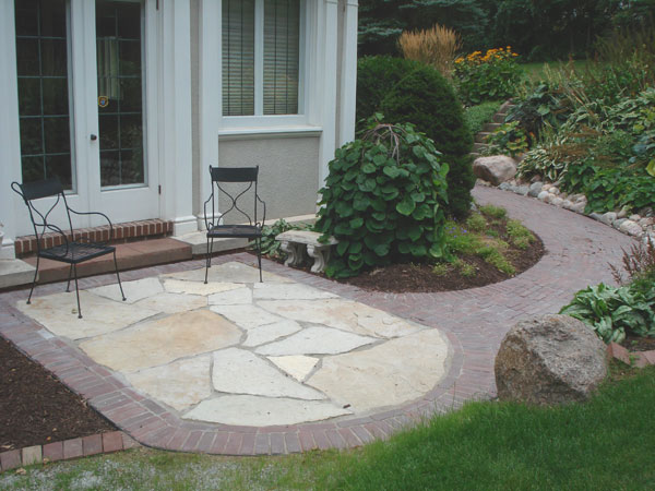Flagstone inset into walkway to create patio space