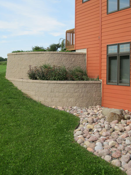 Retaining walls serving as planters for additional greenery